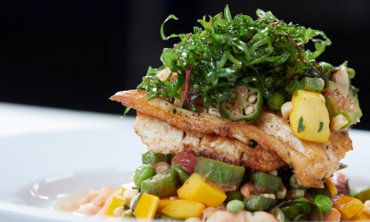 Chef Kevin Mitchell’s Pan Seared Kahala with Shrimp & Spring Vegetable Succotash