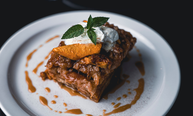 Roy’s Grille Croissant Bread Pudding with Peach Pecan Crust & Bourbon Sauce